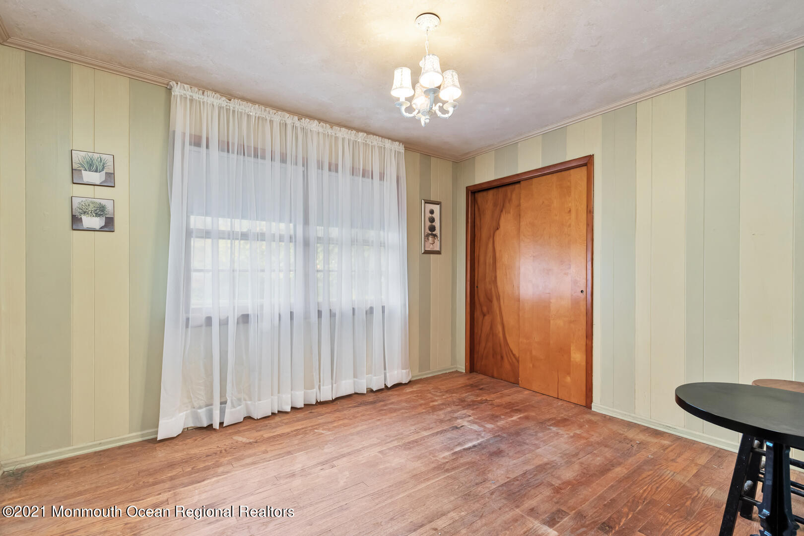 110 Bethany Road Hazlet, NJ 07730 - Photo 15 of 22 a view of a livingroom with a chandelier
