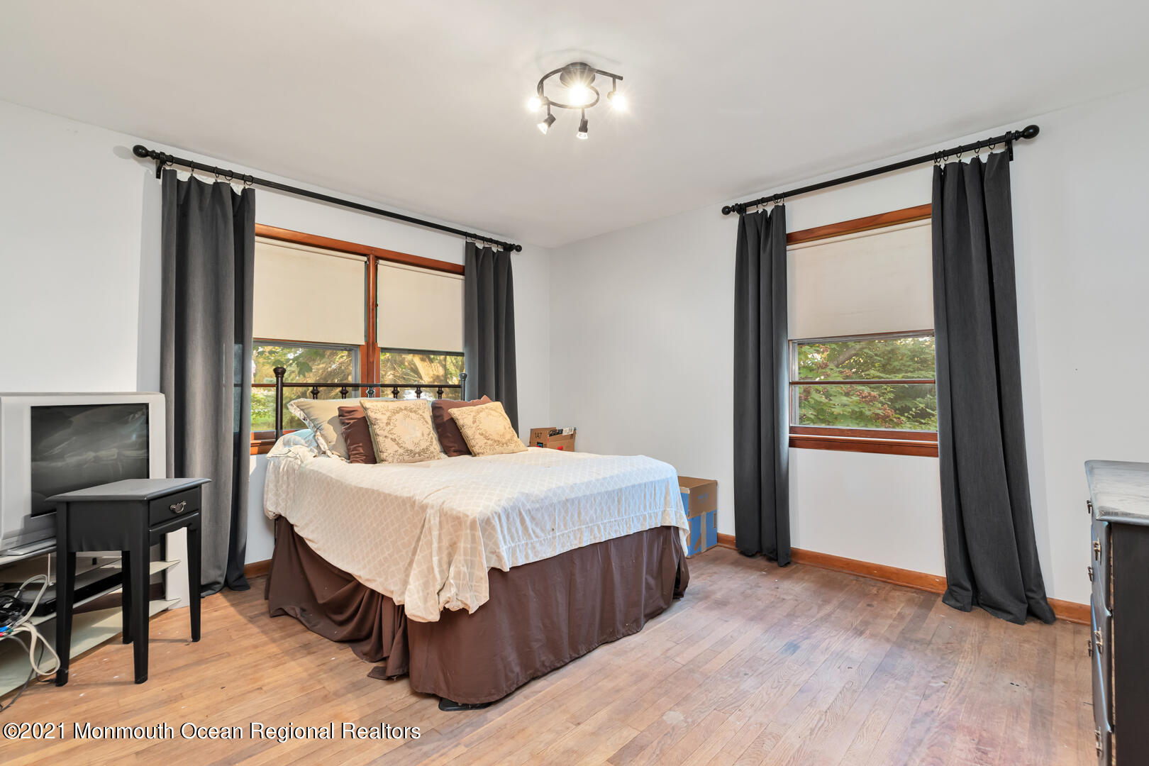 110 Bethany Road Hazlet, NJ 07730 - Photo 16 of 22 a bedroom with a bed table and a window
