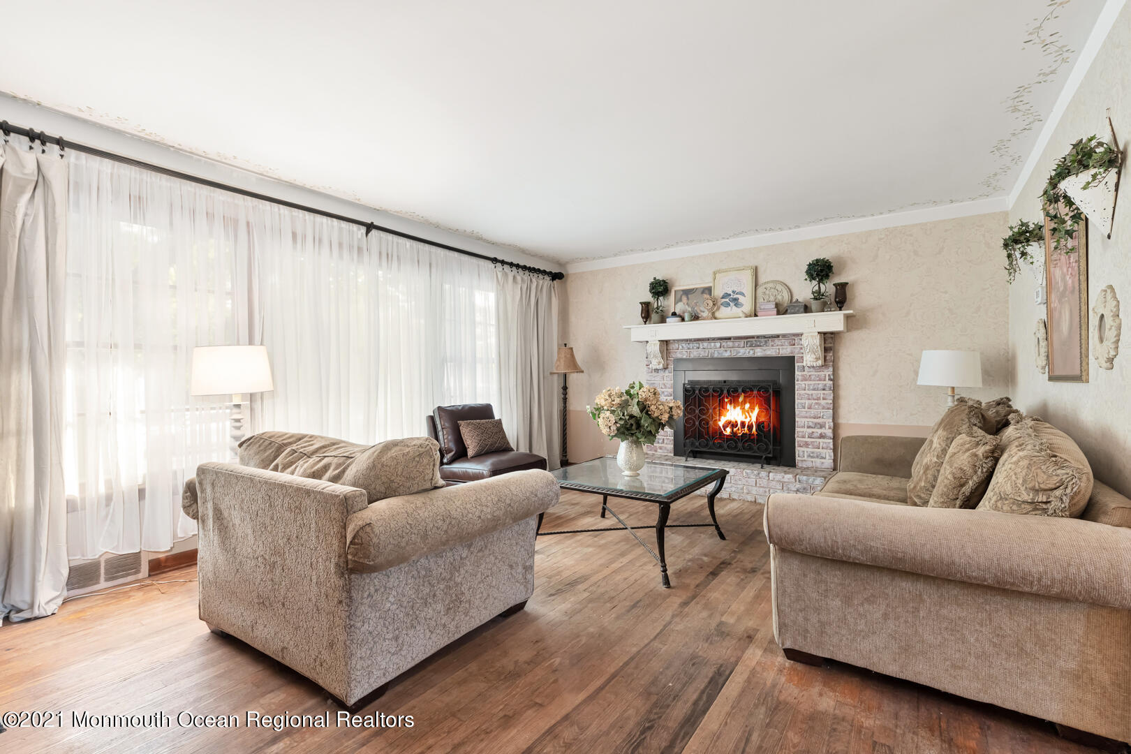 110 Bethany Road Hazlet, NJ 07730 - Photo 3 of 22 a living room with furniture and a fireplace