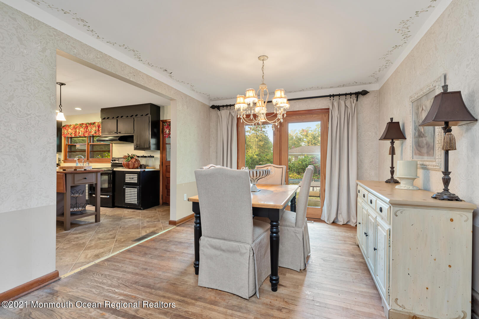 110 Bethany Road Hazlet, NJ 07730 - Photo 6 of 22 a view of a dining room with furniture and a chandelier