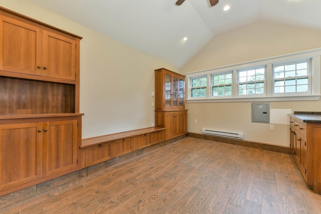 28 Sumner Street, Unit 28 Newton, MA 02459 - Photo 30 of 32 an empty room with wooden floor and windows