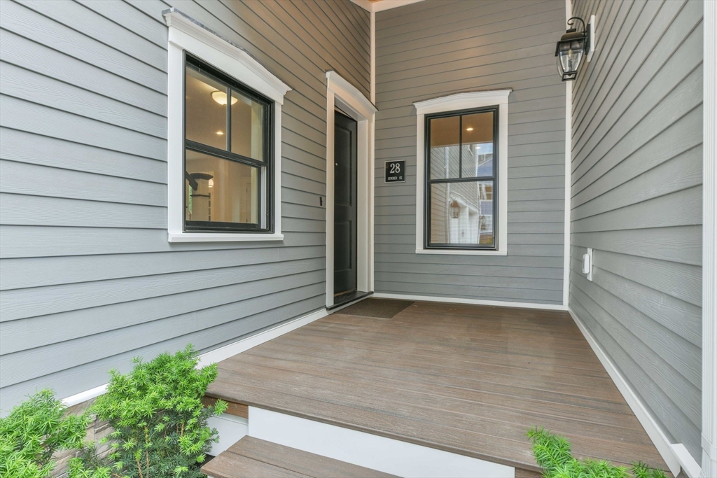 28 Sumner Street, Unit 28 Newton, MA 02459 - Photo 3 of 32 a view of a backyard of a house