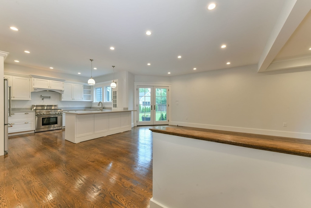 28 Sumner Street, Unit 28 Newton, MA 02459 - Photo 4 of 32 a view of kitchen with kitchen island sink and center island