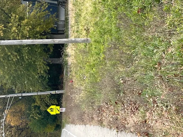 a view of a back yard from a balcony