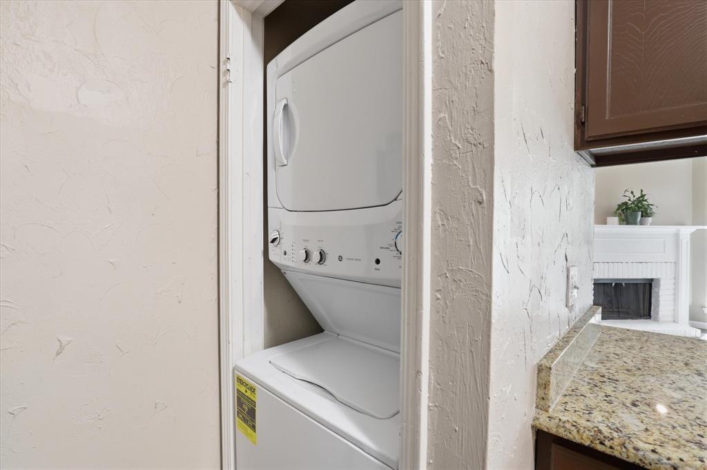 5616 Preston Oaks Road, Unit 404 Dallas, TX 75254 - Photo 19 of 34 Stacked washer and dryer come with the condo.