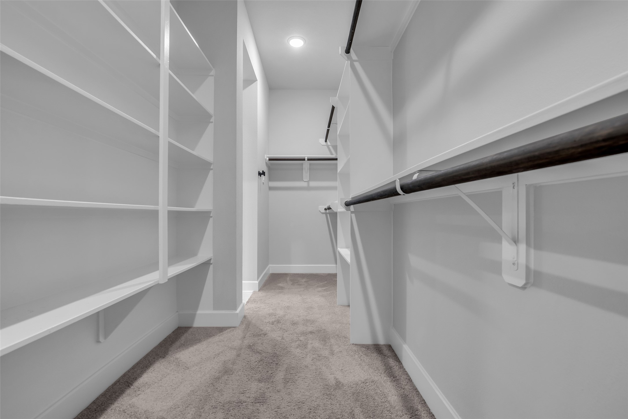 215 Flower Moon Court Conroe, TX 77318 - Photo 24 of 44 a view of walk in closet with empty racks