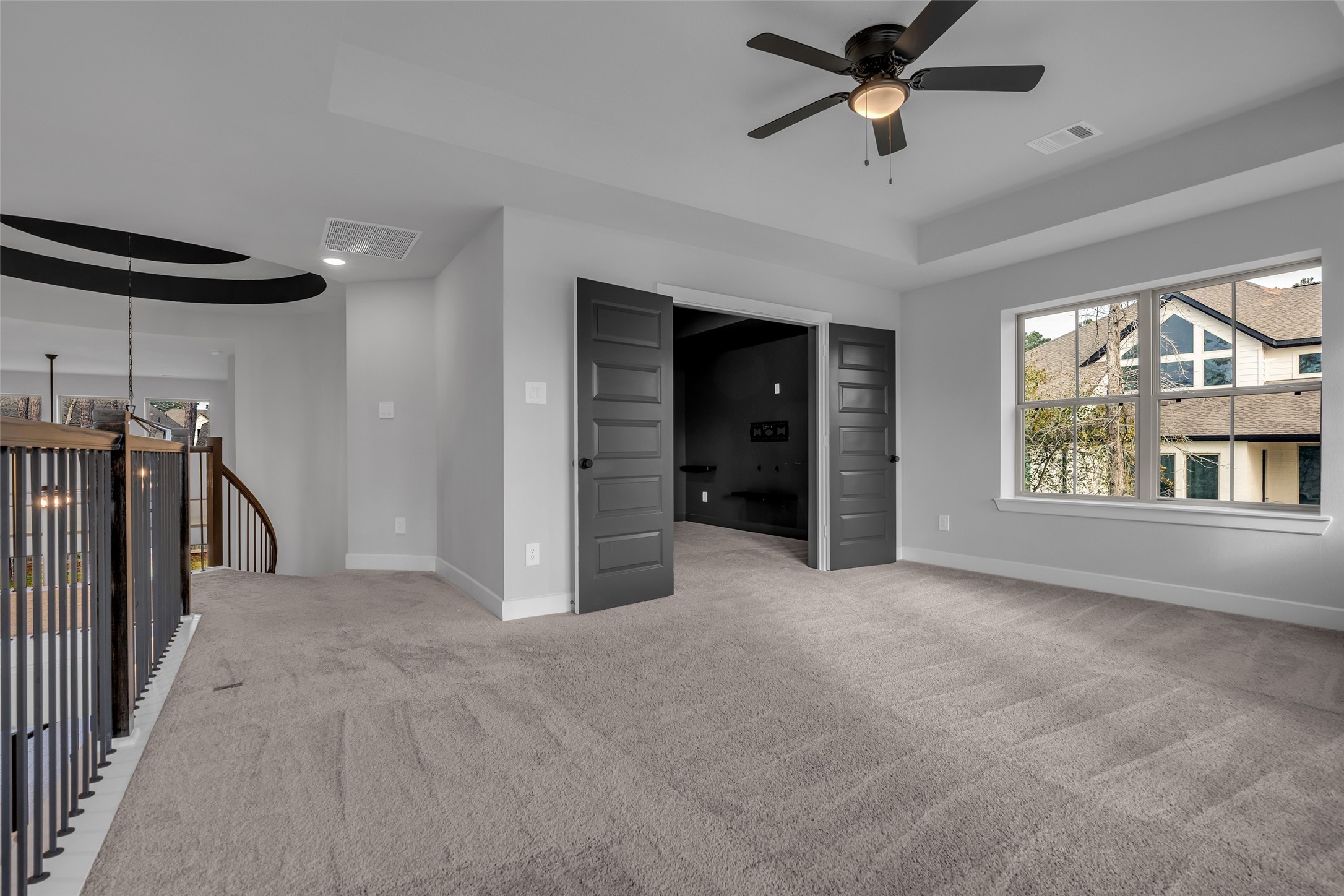 215 Flower Moon Court Conroe, TX 77318 - Photo 26 of 44 a view of empty room with a ceiling fan and window
