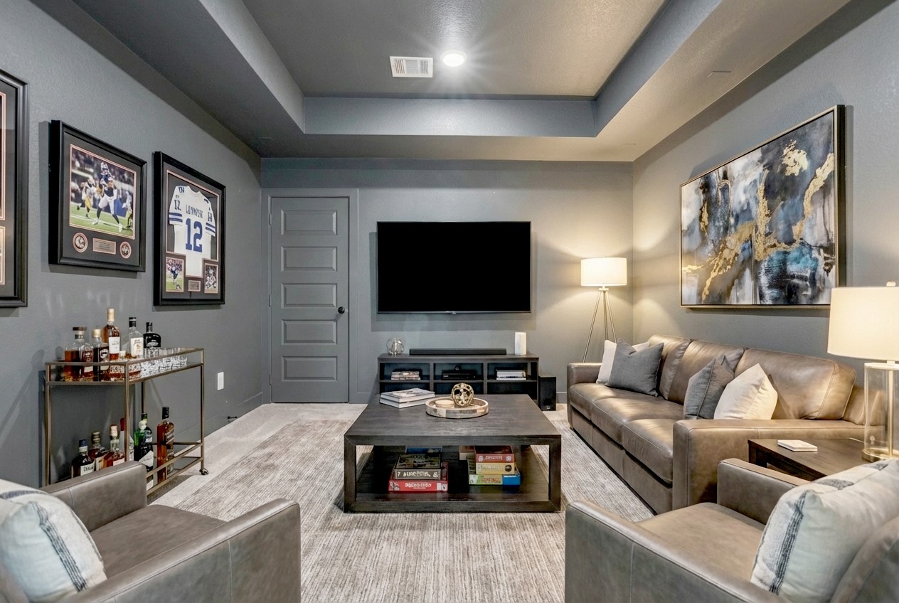 215 Flower Moon Court Conroe, TX 77318 - Photo 30 of 44 a living room with furniture and a flat screen tv