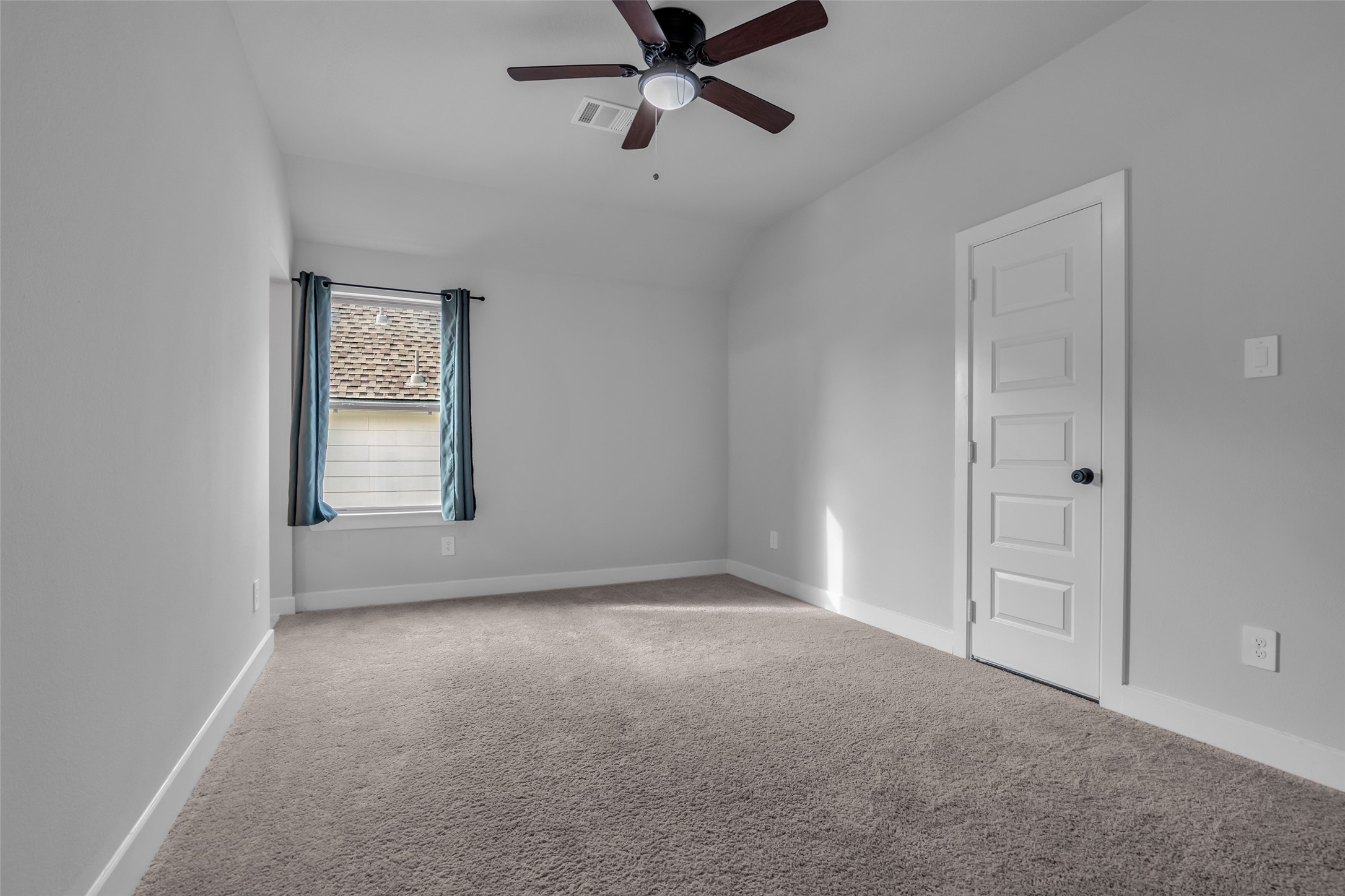 215 Flower Moon Court Conroe, TX 77318 - Photo 31 of 44 a view of an empty room with a window