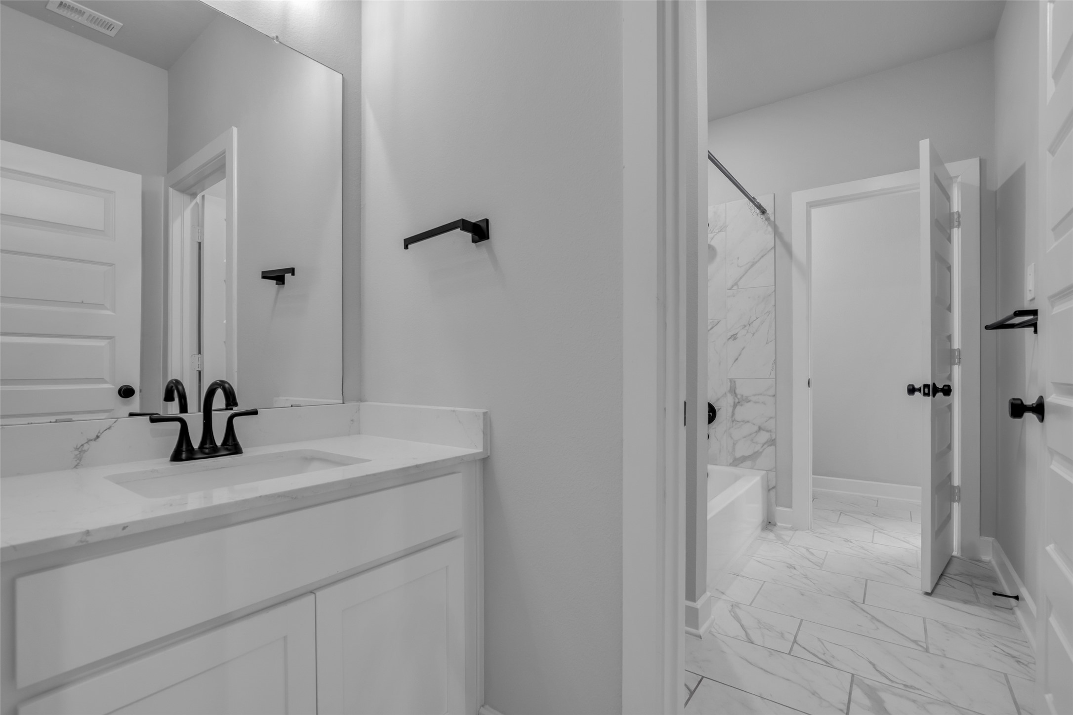 215 Flower Moon Court Conroe, TX 77318 - Photo 32 of 44 a bathroom with a sink and a mirror