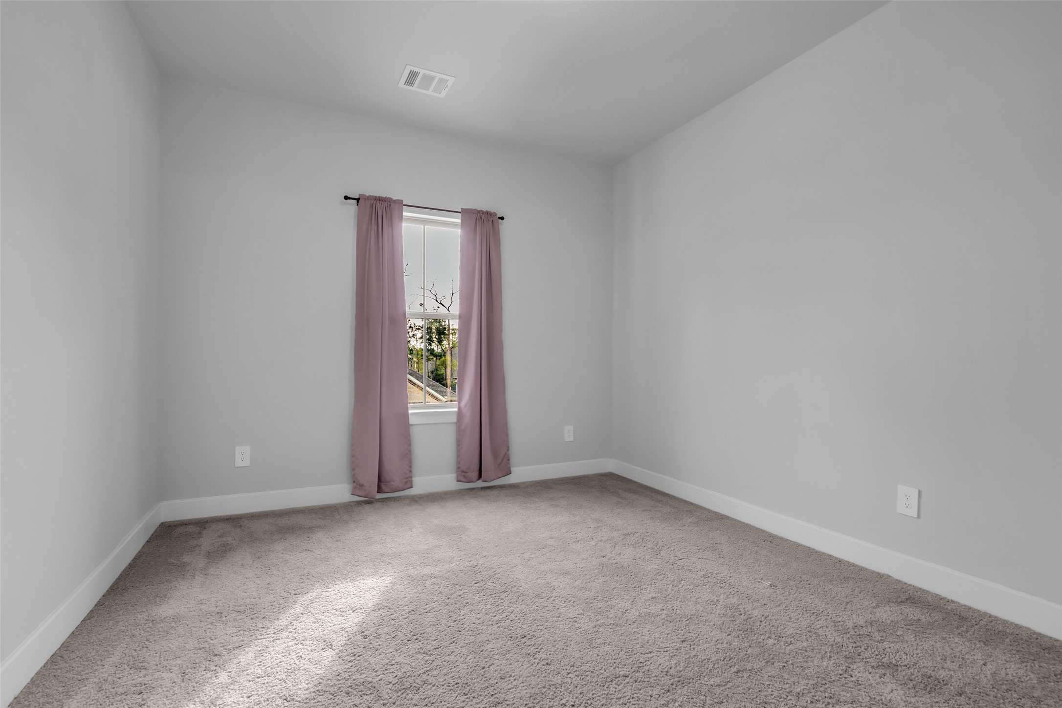 215 Flower Moon Court Conroe, TX 77318 - Photo 33 of 44 an empty room with windows