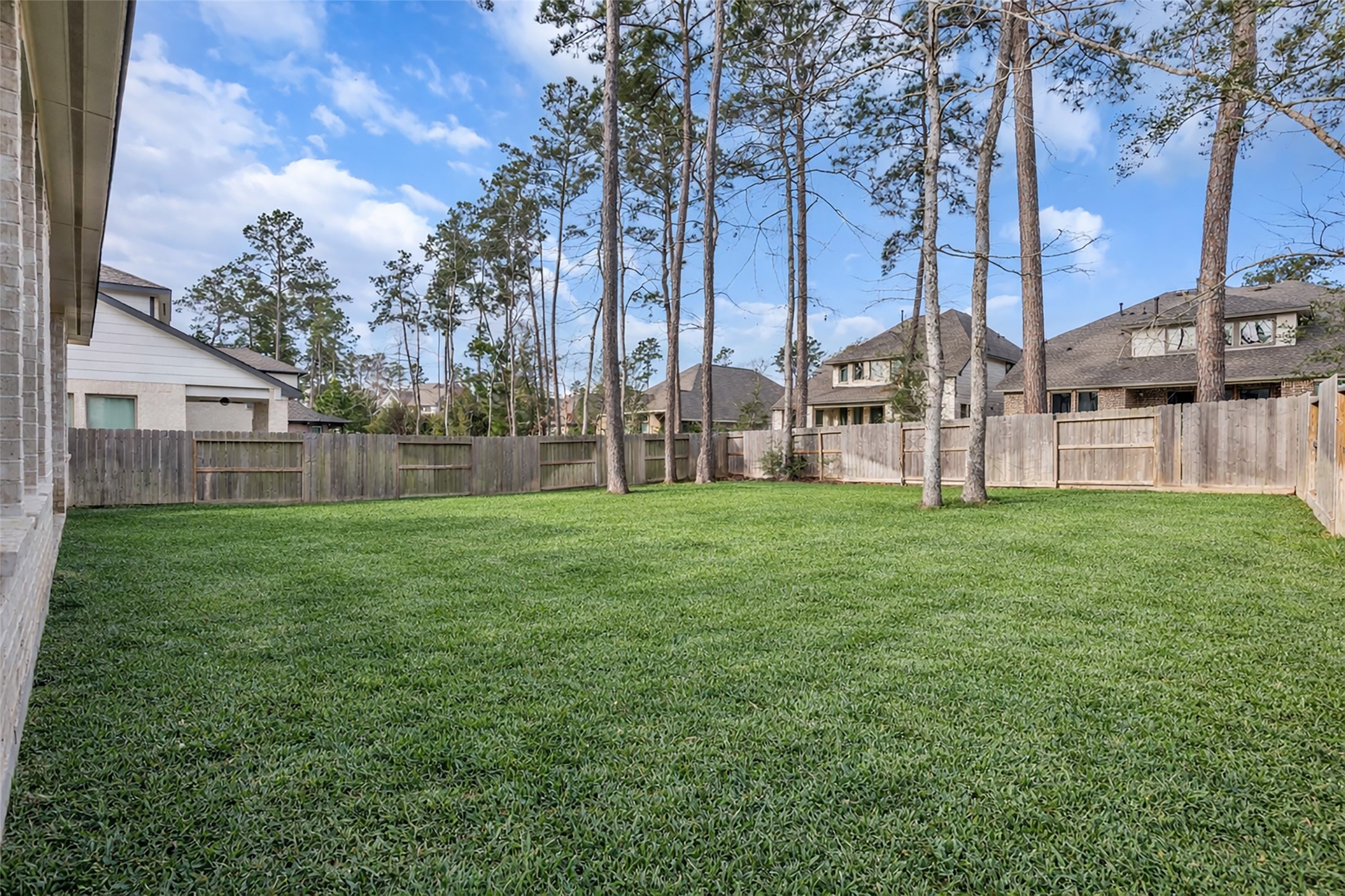 215 Flower Moon Court Conroe, TX 77318 - Photo 35 of 44 a view of a house with a yard