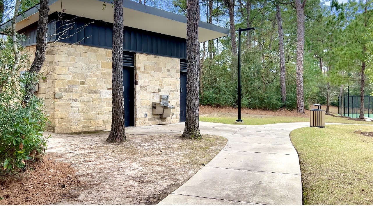215 Flower Moon Court Conroe, TX 77318 - Photo 40 of 44 a view of a house with a yard