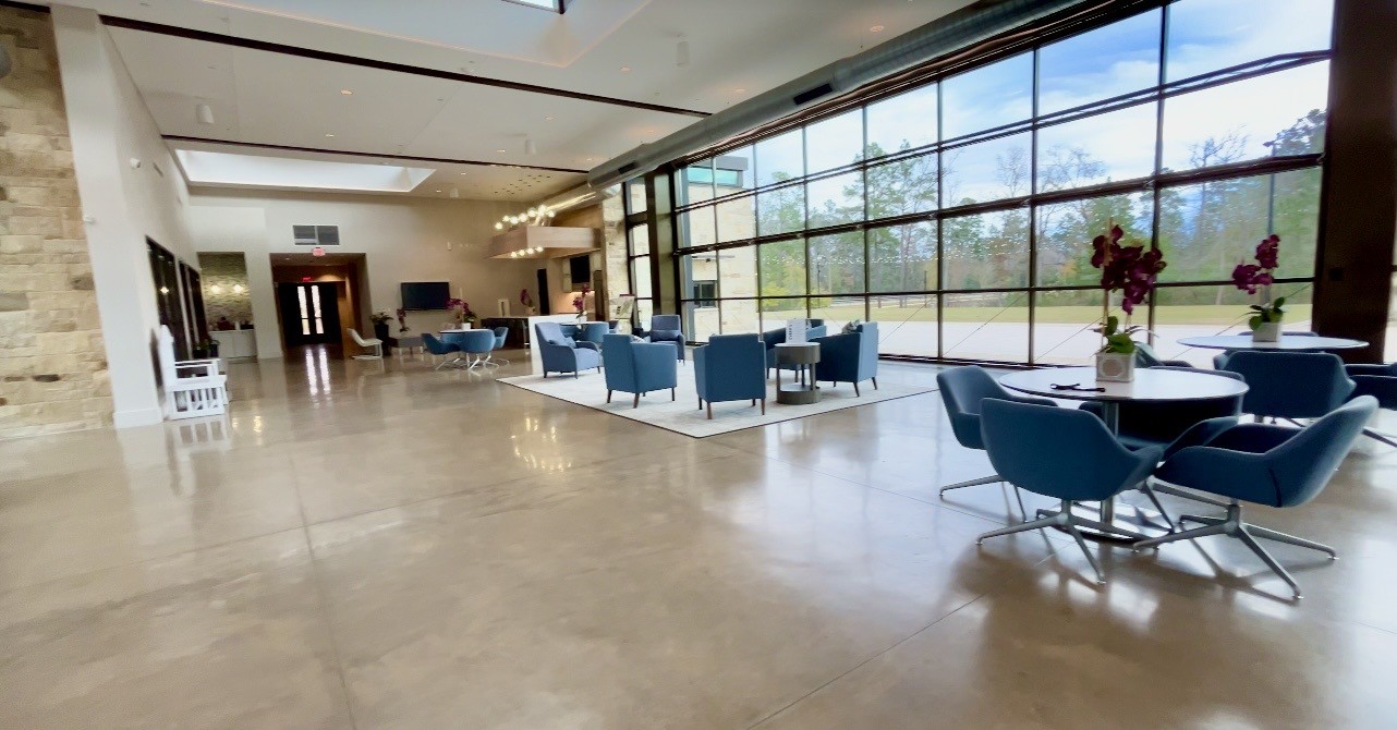 215 Flower Moon Court Conroe, TX 77318 - Photo 43 of 44 a living room with furniture and large windows