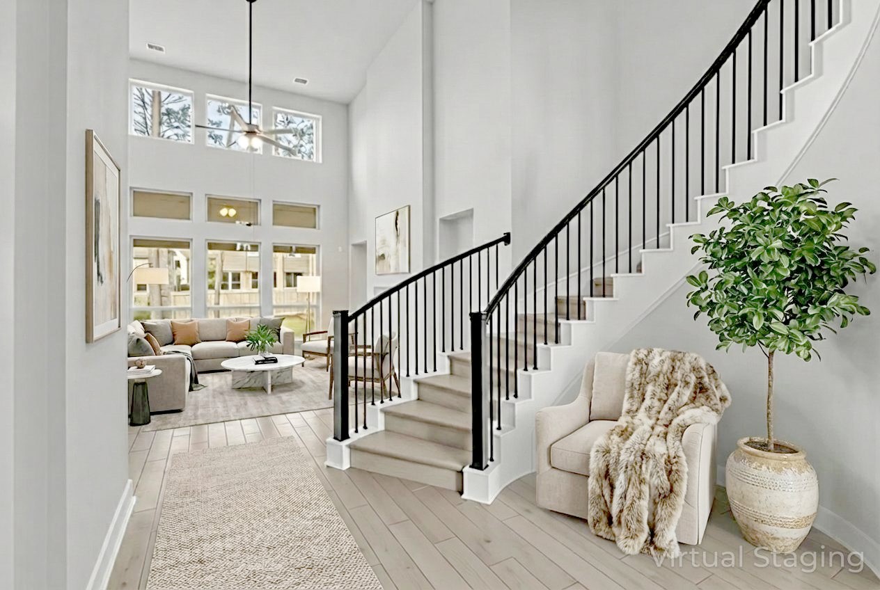 215 Flower Moon Court Conroe, TX 77318 - Photo 7 of 44 a lobby with furniture and a chandelier