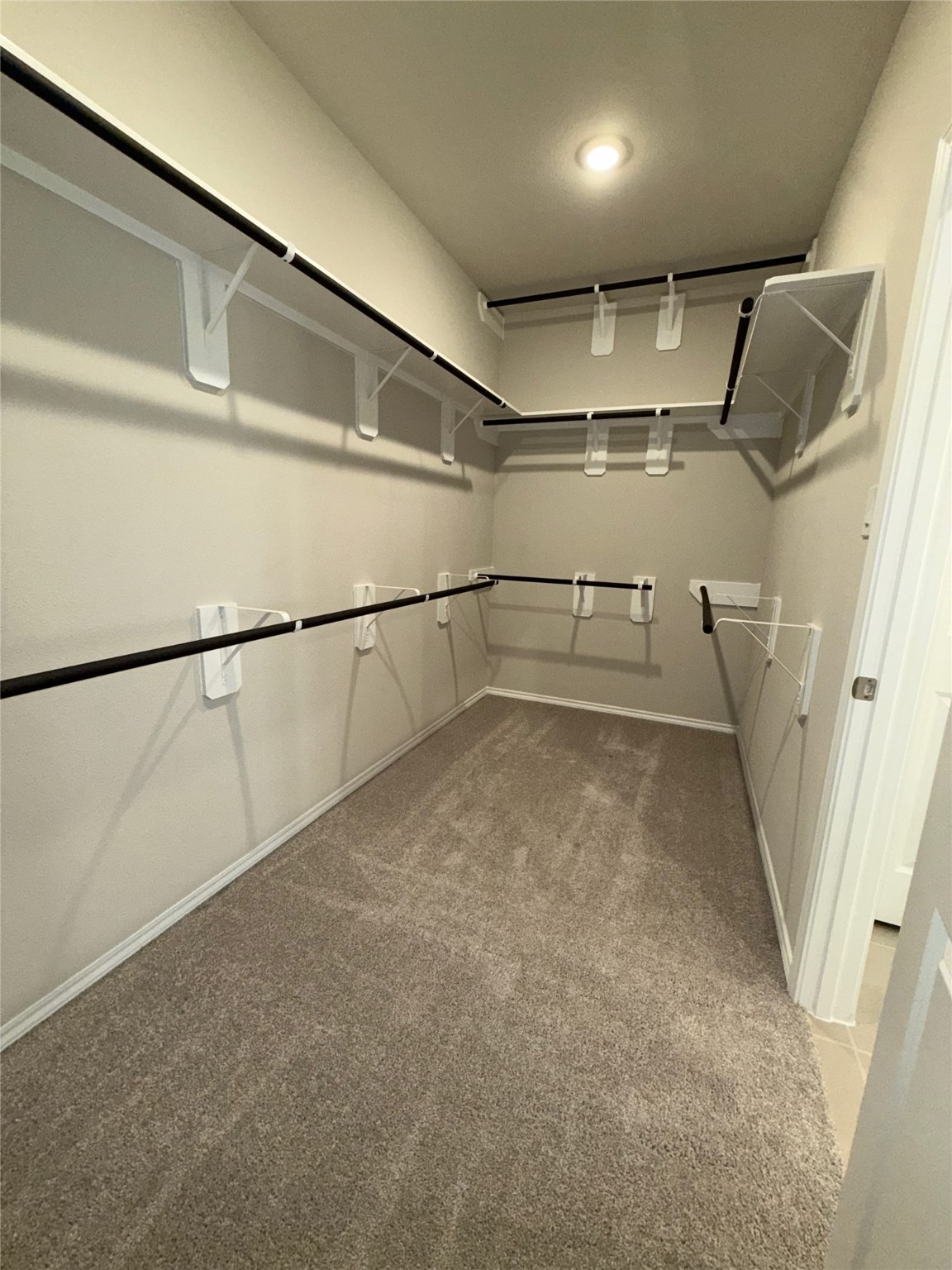 31965 Retama Rnch Drive Spring, TX 77386 - Photo 17 of 18 a view of a room with racks on the wall