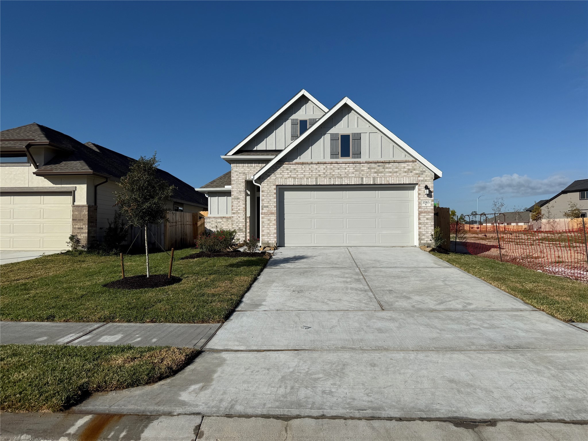 31965 Retama Rnch Drive Spring, TX 77386 - Photo 2 of 18 a front view of a house with a yard