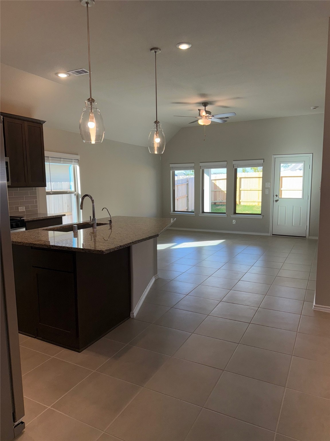 31965 Retama Rnch Drive Spring, TX 77386 - Photo 6 of 18 a kitchen with a sink a counter space appliances and cabinets