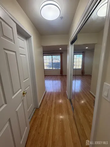 a view of gallery with wooden floor