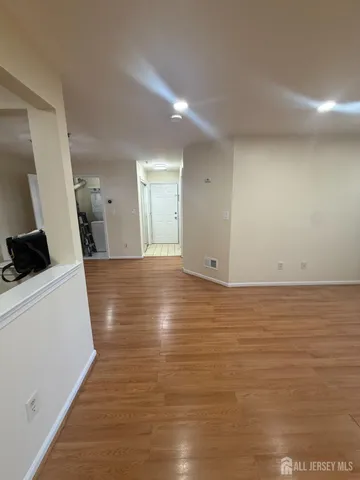 a view of a room with wooden floor and sink