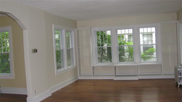 151 Shawmut Street Springfield, MA 01108 - Photo 8 of 12 a view of an empty room with wooden floor and a window