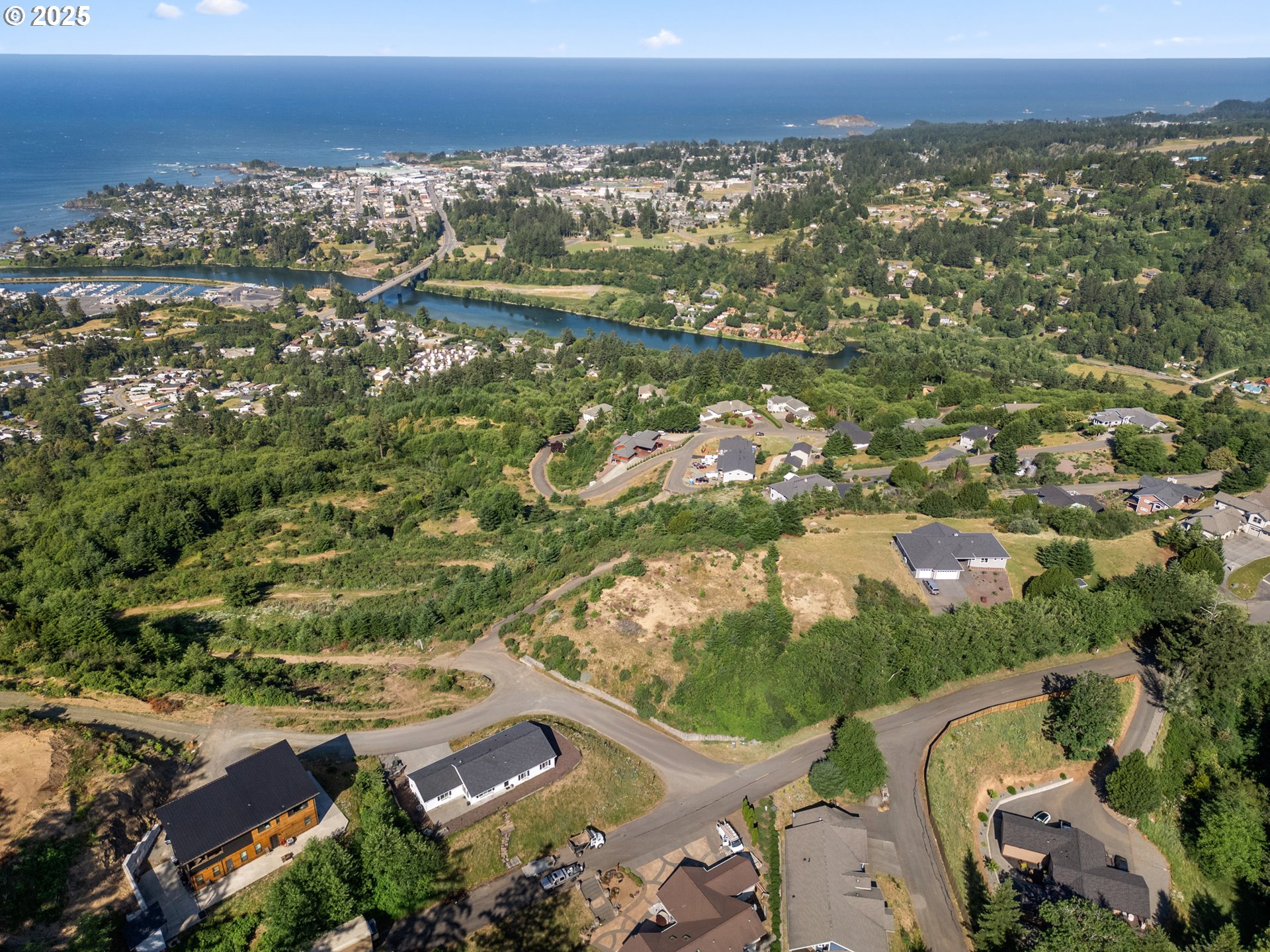 Crown Terrace Loop, Unit 2 Brookings, OR 97415 - Photo 14 of 23 an aerial view of residential building and trees around