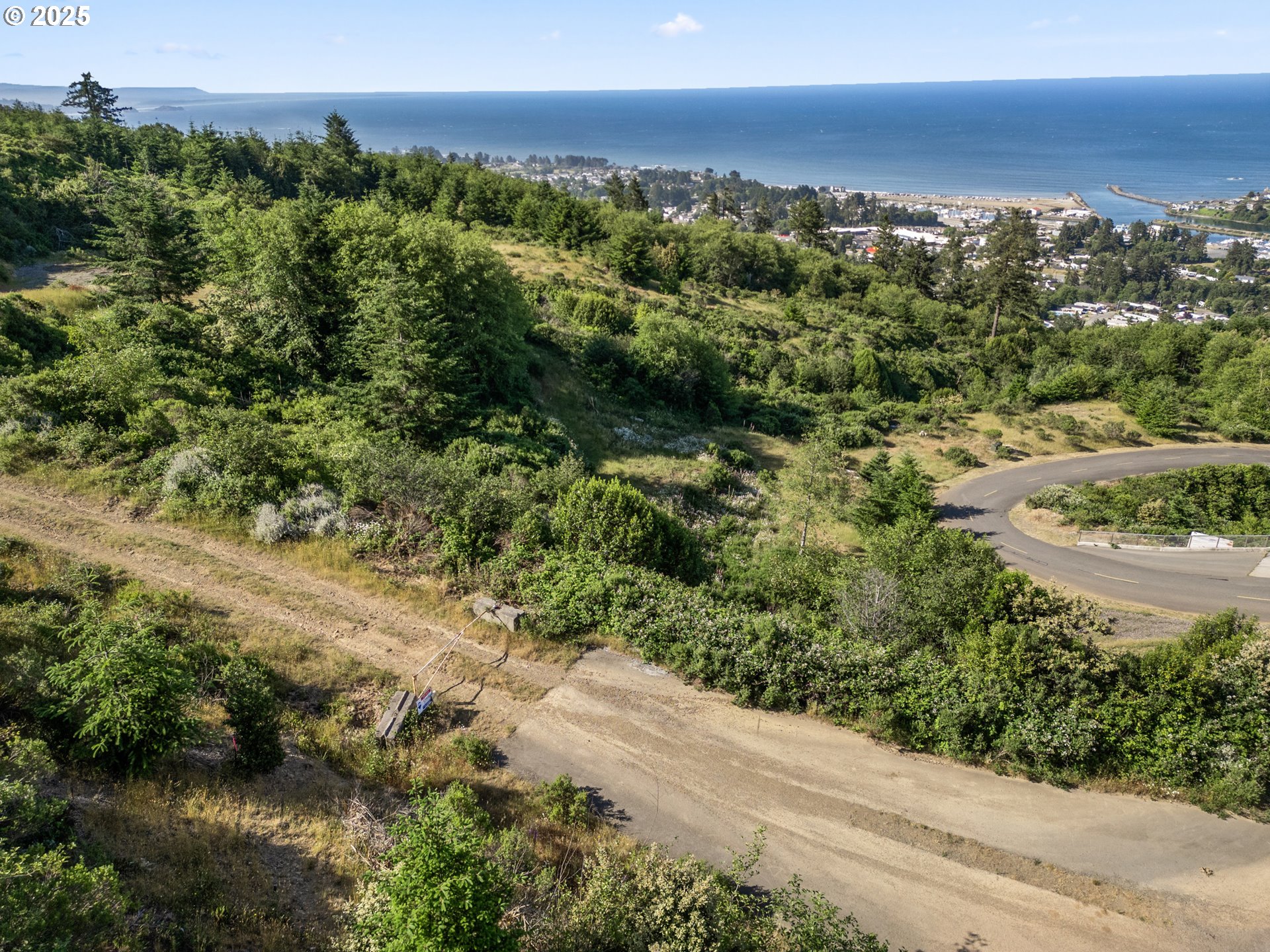 Crown Terrace Loop, Unit 2 Brookings, OR 97415 - Photo 18 of 23 a view of a lake with a city