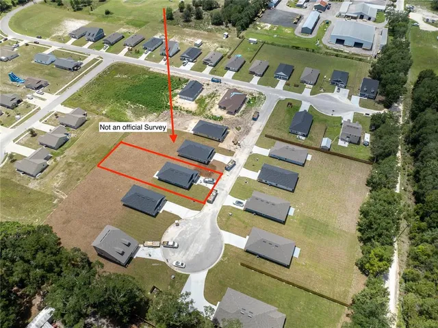 an aerial view of residential house with outdoor space and parking