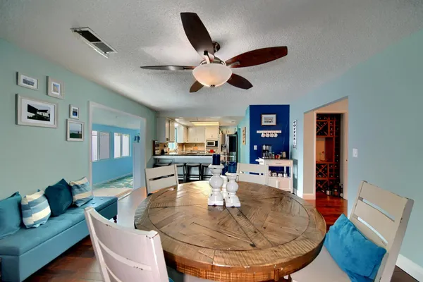 a view of a living room and dining room with furniture