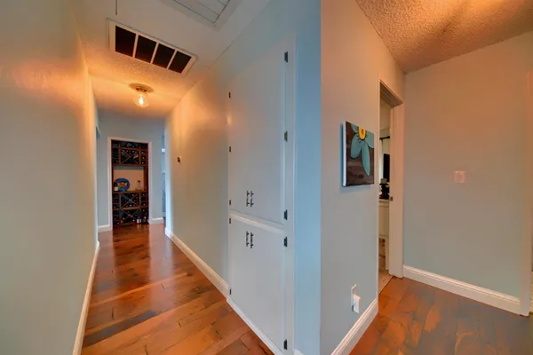 a view of walk in closet with clothes
