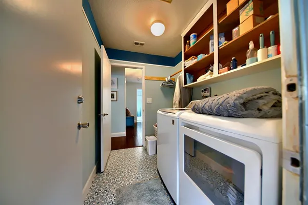 a view of a kitchen with a sink and a tub