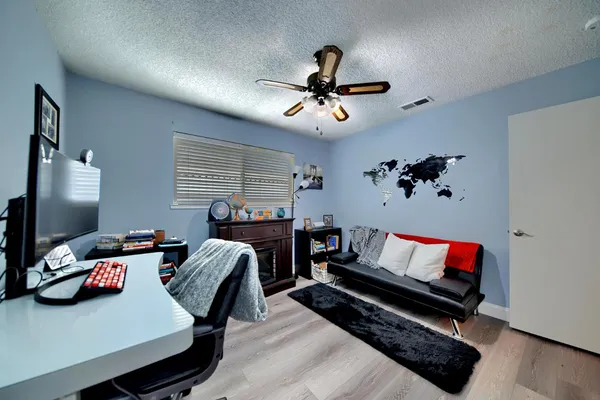 a view of kitchen with stainless steel appliances granite countertop sink and cabinets