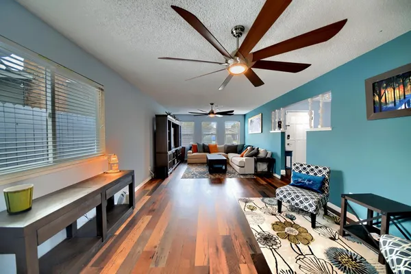 a large kitchen with stainless steel appliances granite countertop a stove and a sink