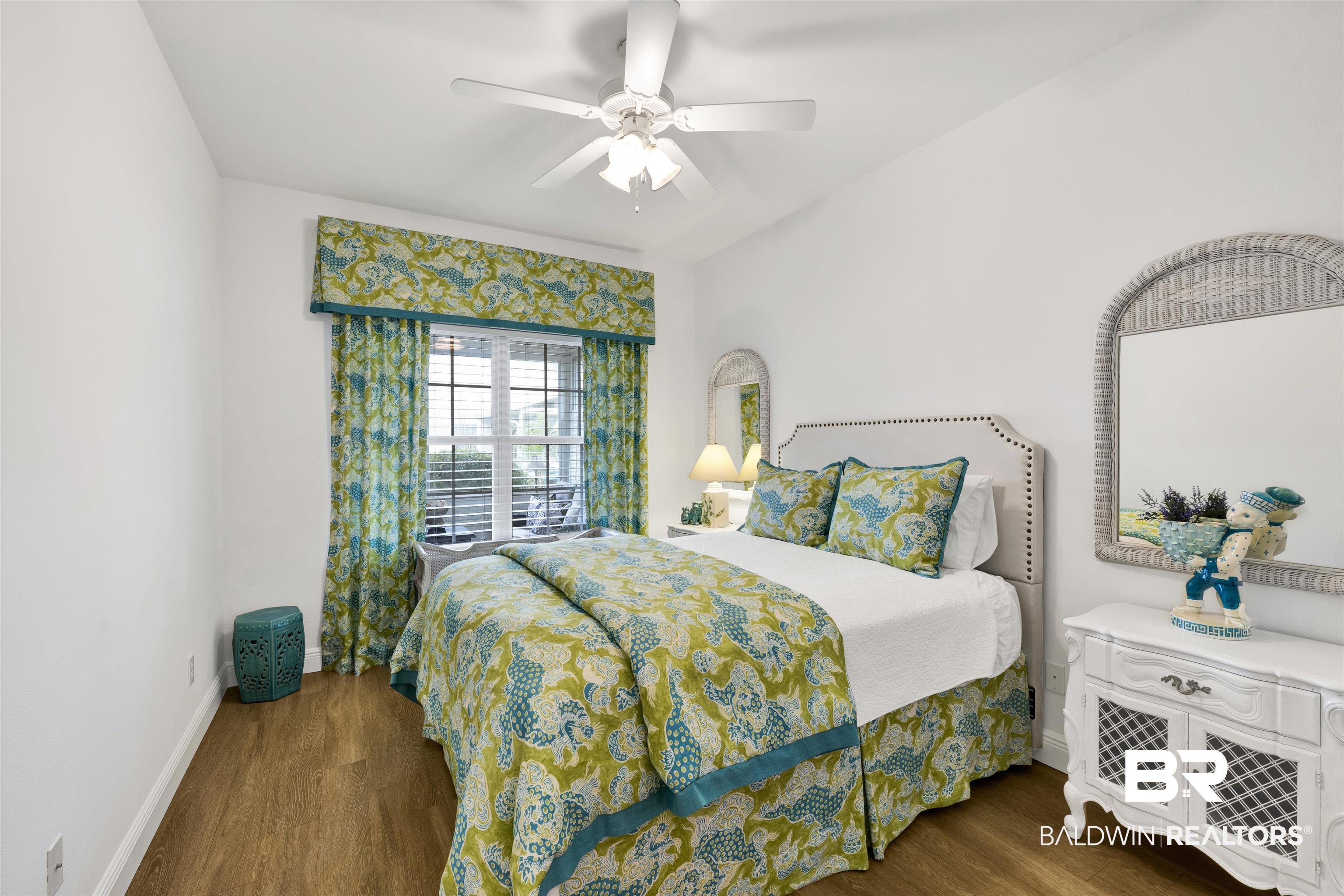 164 Mark Twain Loop Foley, AL 36535 - Photo 21 of 25 Bedroom with dark wood-style floors and ceiling fan