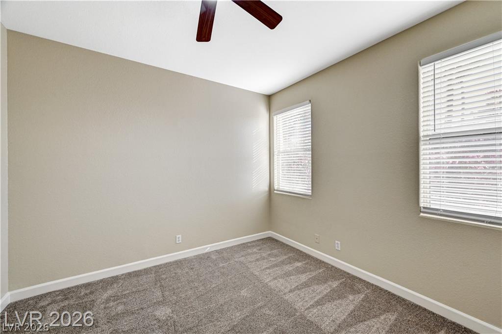 2283 Ramsgate Drive Henderson, NV 89074 - Photo 34 of 51 Plush carpeting and multiple windows anchor this versatile secondary bedroom space.