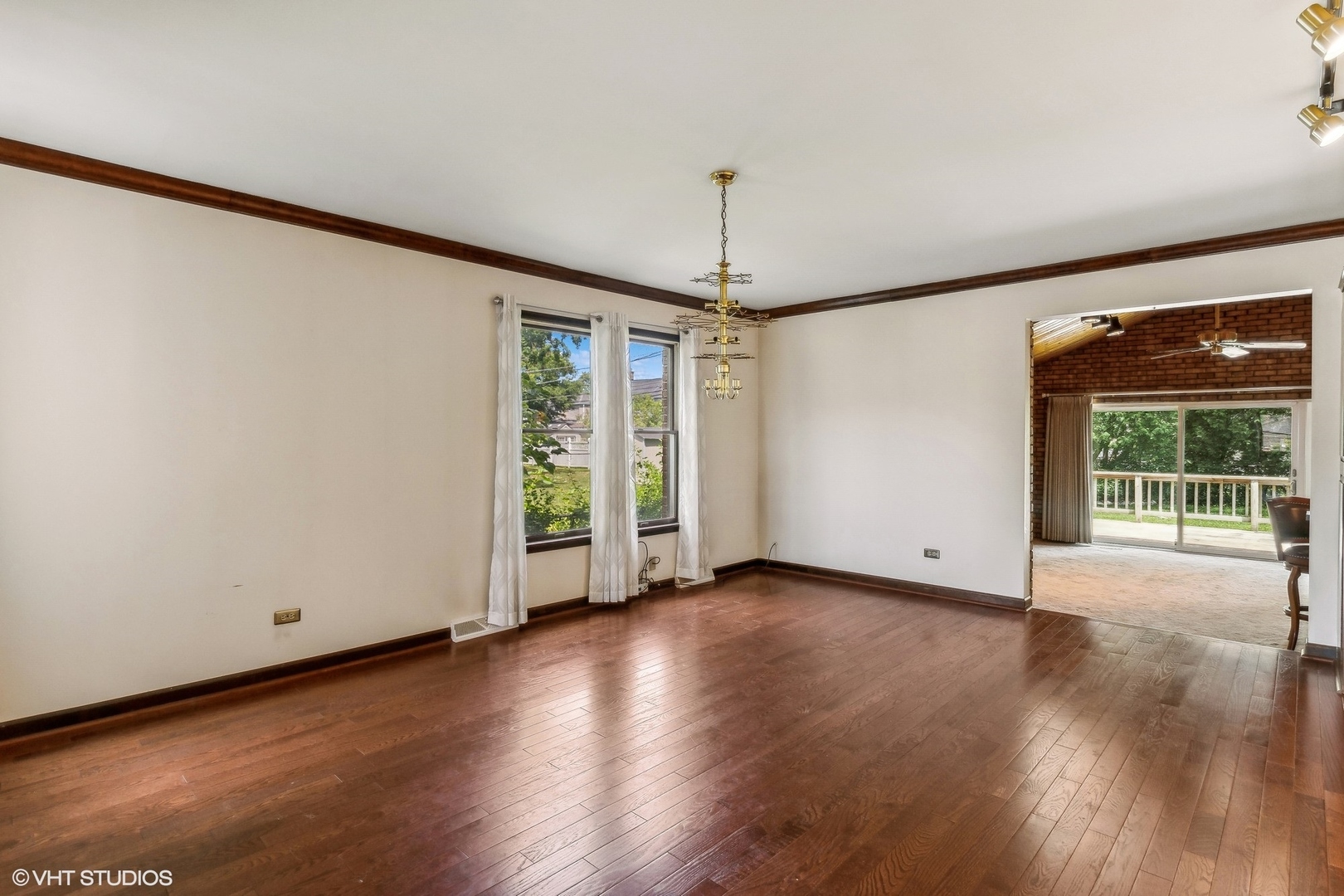 405 North Pine Street Mount Prospect, IL 60056 - Photo 3 of 22 a view of an empty room with wooden floor and a window