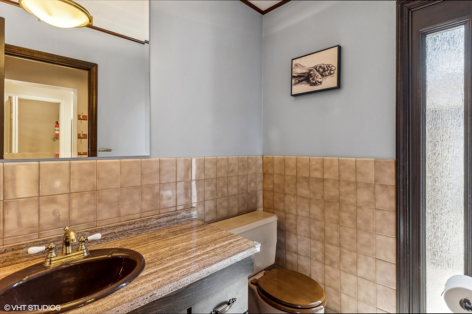 405 North Pine Street Mount Prospect, IL 60056 - Photo 6 of 22 a bathroom with a granite countertop sink and a mirror