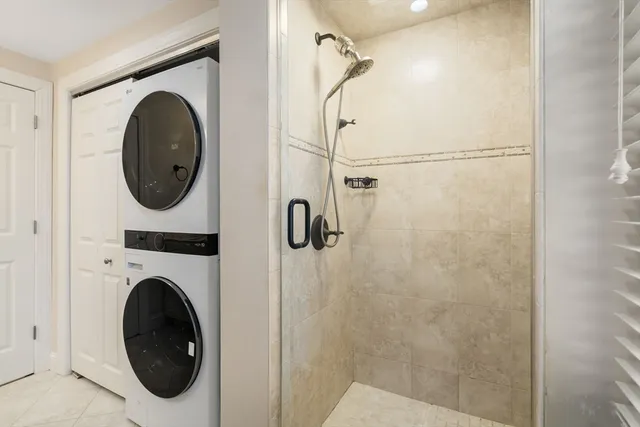 a close view of a utility room with dryer and washer