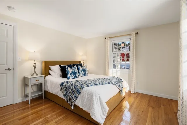 a bedroom with a bed and a night stand