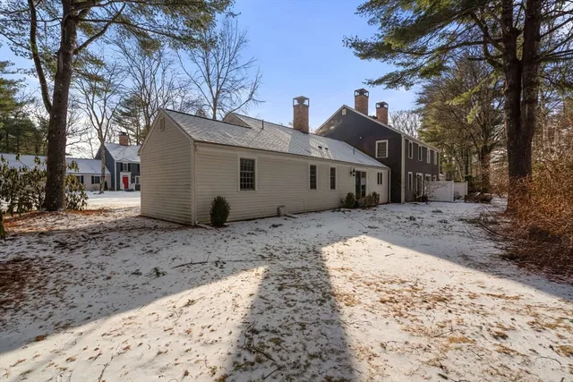 a view of a house with a snow on the road