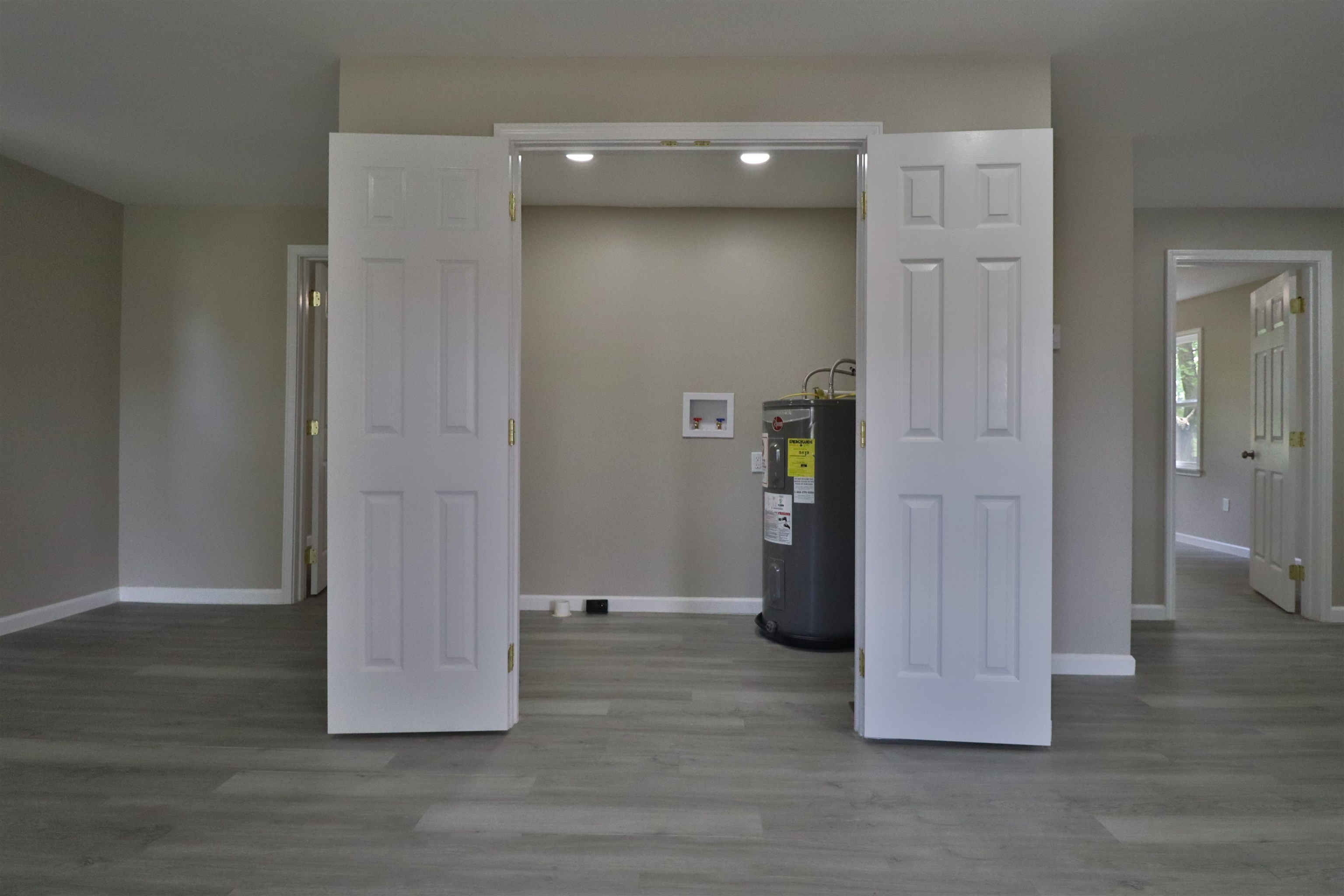 224 Kellar Avenue Ripley, TN 38063 - Photo 10 of 30 a view of a hallway with wooden floor and closet