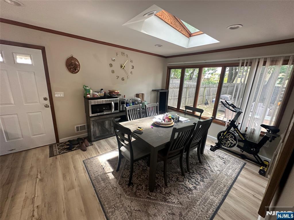500 New Bridge Road Bergenfield, NJ 07621 - Photo 4 of 10 a view of a dining room with furniture window and wooden floor