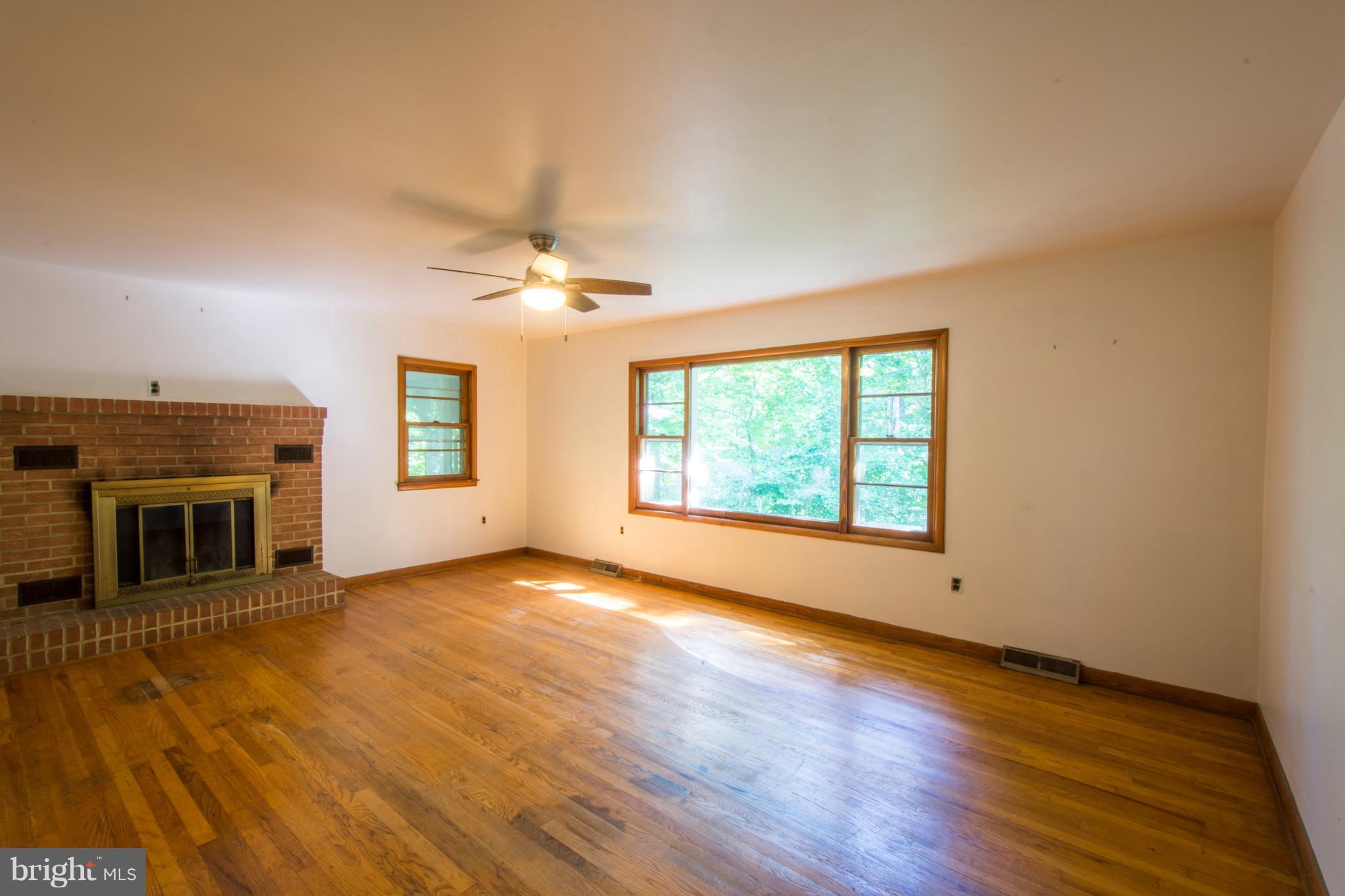 3203 Brezina Place Edgewater, MD 21037 - Photo 5 of 26 Living Room With Wood Burning Stove