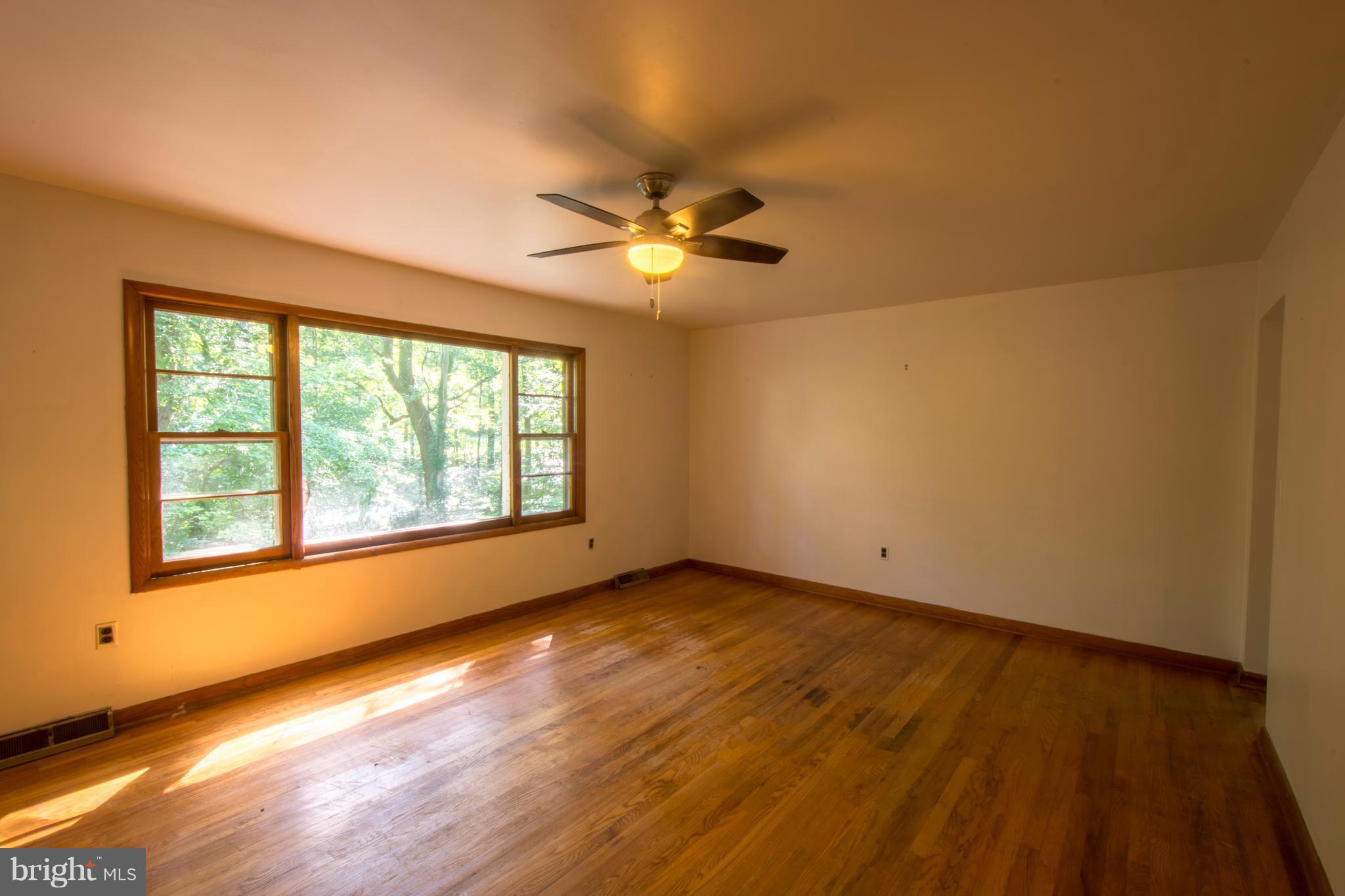 3203 Brezina Place Edgewater, MD 21037 - Photo 8 of 26 Living Room With Views Of Woods