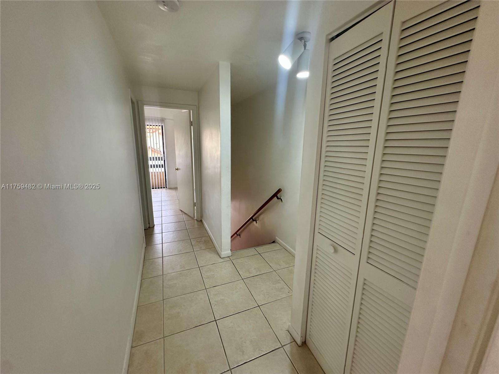 10023 Southwest 77th Court Miami, FL 33156 - Photo 13 of 22 a view of an empty room
