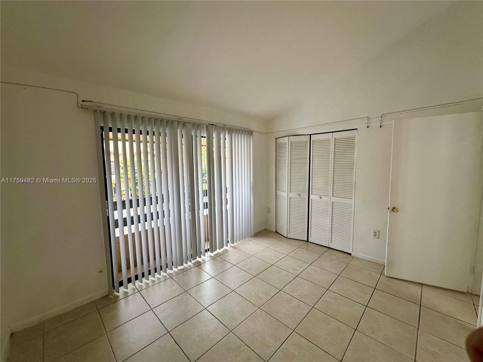 10023 Southwest 77th Court Miami, FL 33156 - Photo 14 of 22 a view of a room with entryway