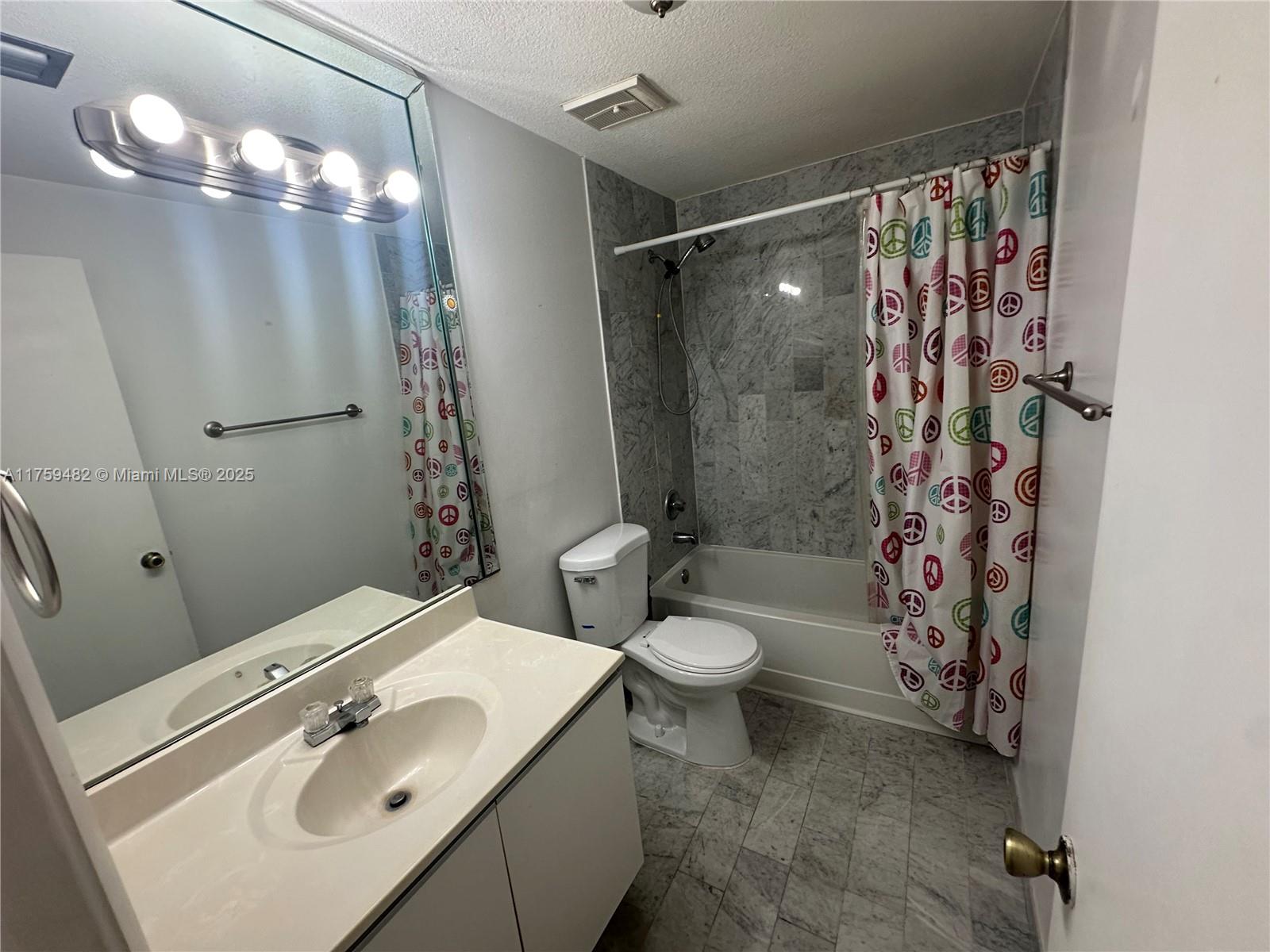 10023 Southwest 77th Court Miami, FL 33156 - Photo 15 of 22 a bathroom with a sink toilet and shower
