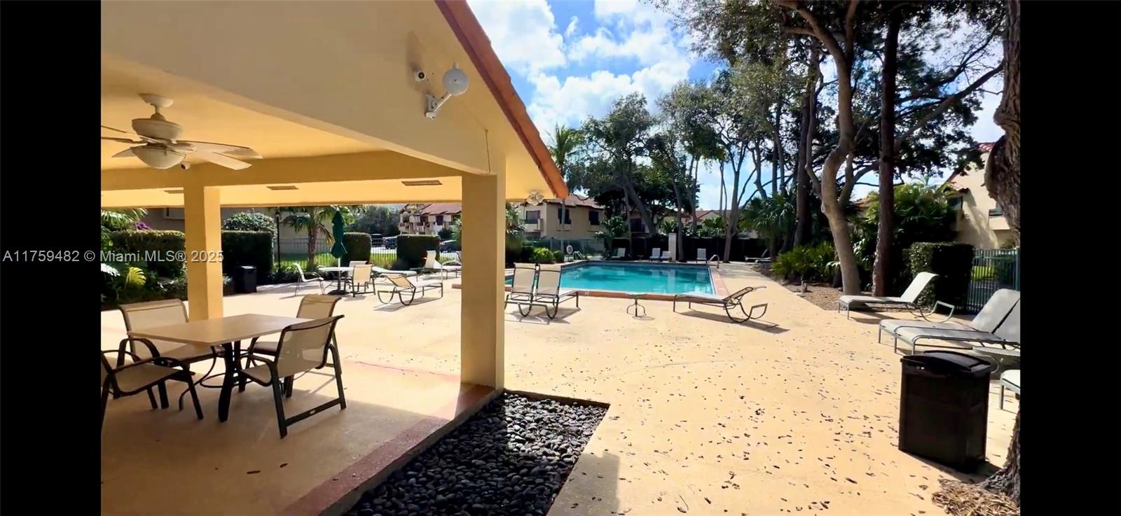 10023 Southwest 77th Court Miami, FL 33156 - Photo 21 of 22 a view of a patio with a dining table and chairs