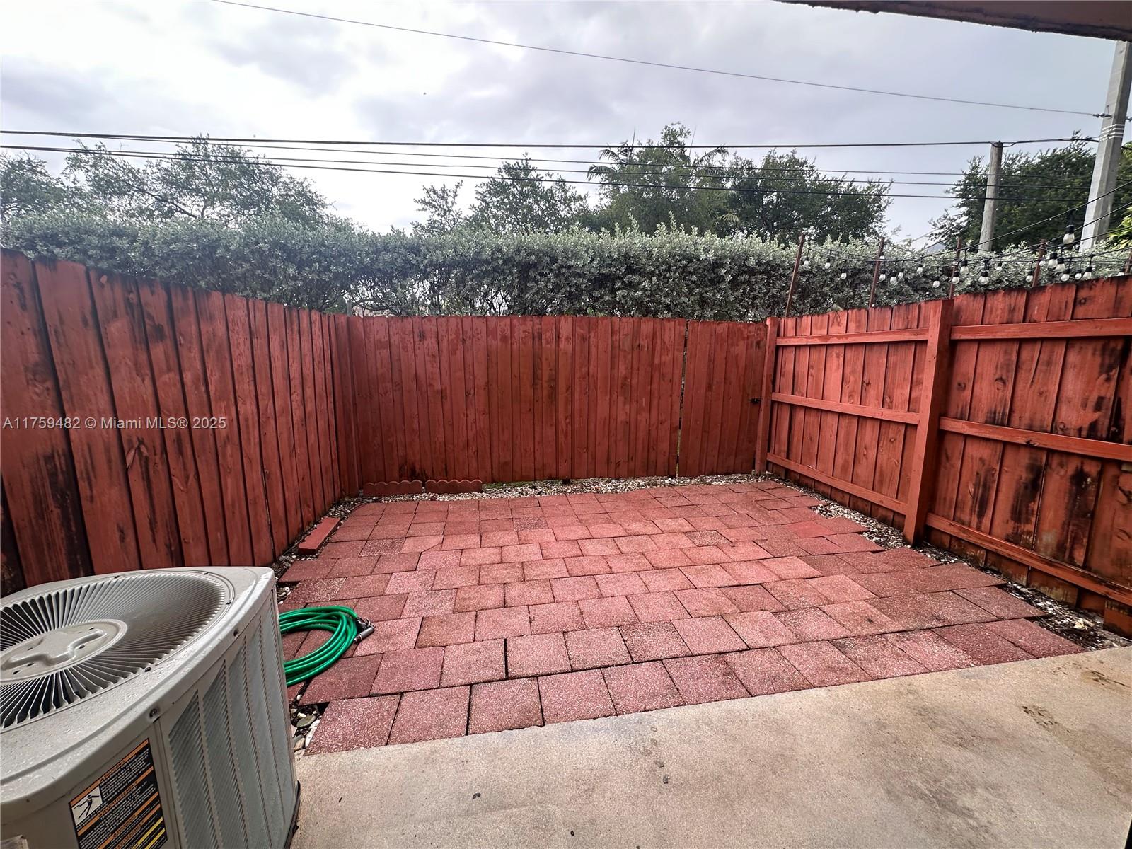 10023 Southwest 77th Court Miami, FL 33156 - Photo 6 of 22 a view of a backyard