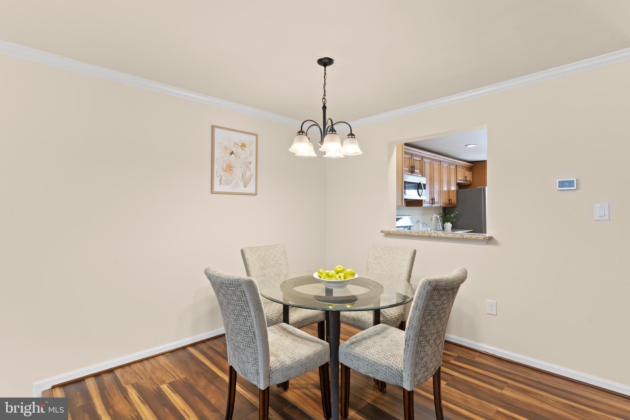 7823 Sabre Court Manassas, VA 20109 - Photo 15 of 39 a view of a dining room with furniture and wooden floor